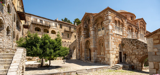 The historic Loukas Monastery in Greece with its beautiful churches and buildings built of warm tinted stones in summer.