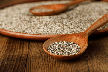 Wooden spoon with chia seeds close up