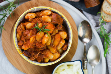 Stewed beans in tomato sauce with herbs and spices.  Top view.