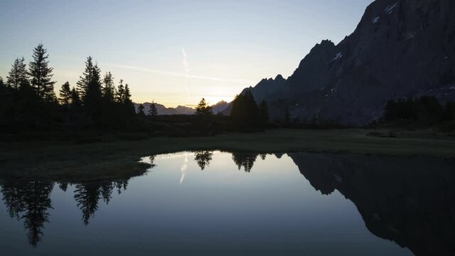 The beautiful summer sunrise morning over the mountains of Grosse Scheidegg in Switzerland - time lapse