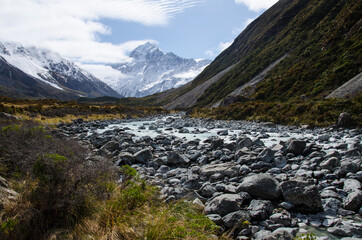 Hooker river with snow covered mountains on Hooker Valley Track, South Island, New Zealand