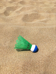 Fototapeta na wymiar badminton shuttlecock on the sand