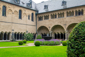 Fototapeta premium inner courtyard of a monastery in the Middle Ages in Germany, where you can enjoy a fountain and lawn
