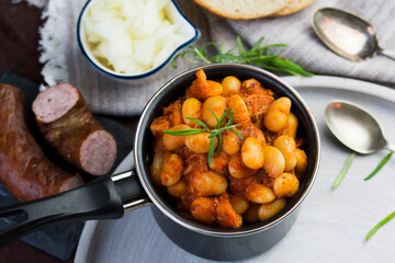 Stewed beans in tomato sauce with herbs and spices.  Top view.