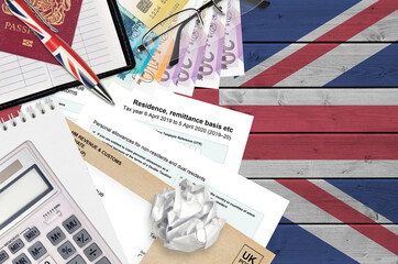 English Tax form sa108 Residence remittance basis etc from HM revenue and customs lies on table...