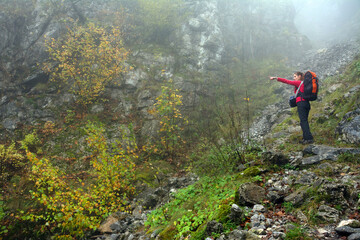 Obraz premium Young brunette girl trekking in Mehedinti Mountains, Romania, Europe