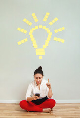 Idea concept, woman with yellow sticky notes shaped in light bulb