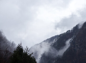 clouds over the mountains in early winter