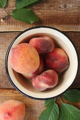 Juicy peaches on a wooden table macro 