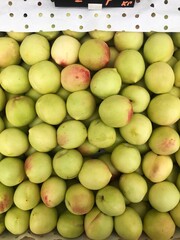 Ripe juicy green nectarines on the market