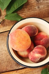 Juicy peaches on a wooden table macro 