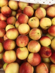 Ripe juicy red nectarines on the market 