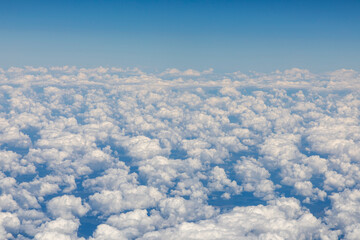 white puffy clouds under clear blue sky