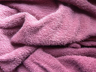 Pink cotton towel with wrinkles