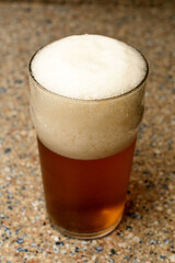 A very well poured beer in a glass