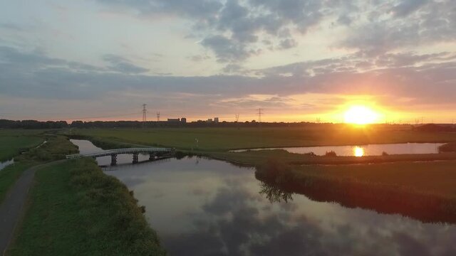 Droneshots of sheeps in the fields of Holland