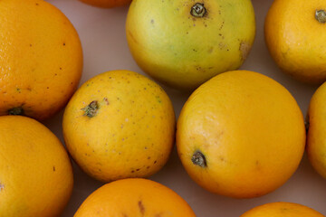 Beautiful oranges arranged on a table. A fruit rich in vitamin c.