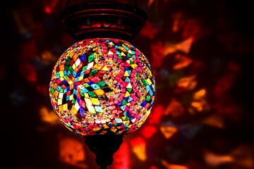 Obraz premium Colorful Traditional Eastern Hanging Lamp / lights reflecting on background