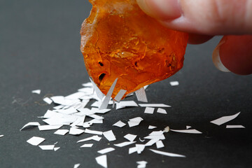 Physical properties of amber. Sun stone properties. An electrified piece of amber attracts pieces...