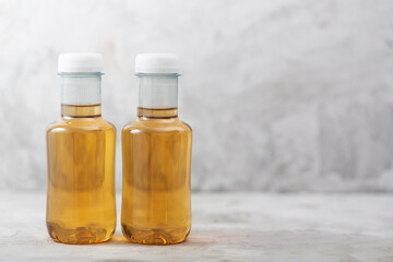 Bottles of ice tea, gray concrete background