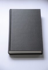 Black blank hardcover book on white background