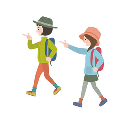 アウトドアの服を着てリュックを背負い楽しそうに歩く女子2人
