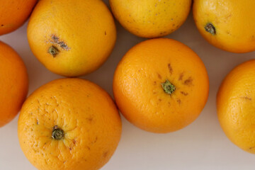 Beautiful oranges arranged on a table. A fruit rich in vitamin c.