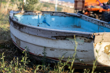 An old, abandoned boat on dirt, feels like a post apocalyptic scene