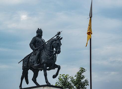 The Statue of King Maharana Pratap and his horse Chetak. The text on yellow flag had name location of the organization who manages the place.