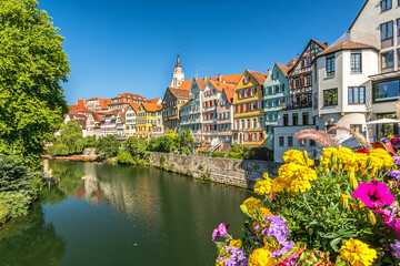 Picturesque old town of the German city of Tübingen with scenic historic houses and colourful flowers on a sunny day in summer - obrazy, fototapety, plakaty