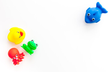 The concept of children’s bath toys. White background top view copyspace