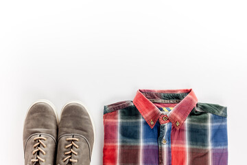  The concept of men's clothing and accessories. Check shirt, wallet, shoes on white background top view flat lay copy space