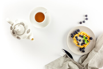 Homemade belgian waffles on served table on white background top view mockup