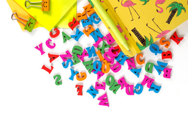 Letters and school supplies on white background.photo with copy space.