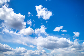Naklejka na ściany i meble Blue sky with white clouds. Beautiful background.