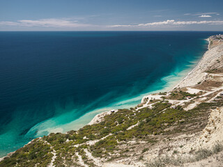 Bay by the sea with colorful water