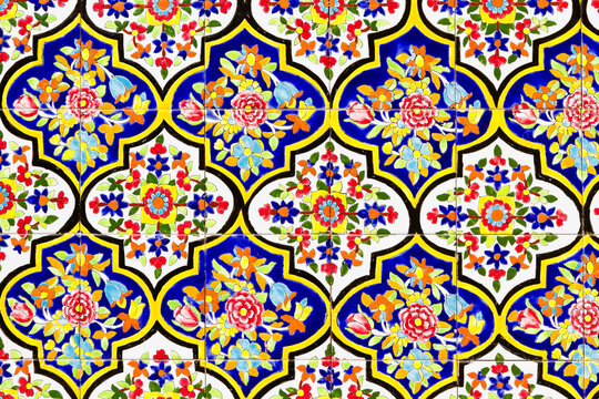 Colorful oriental geometric design and pattern commonly met in Persian mosques and medresses. Isfahan, Shiraz, Teheran, Iran