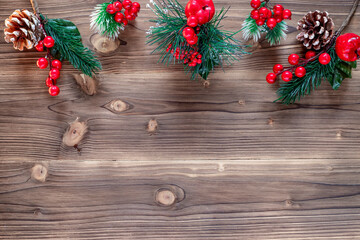 Christmas decoration with pine branches, cones and red berries. Top view. Flat lay.