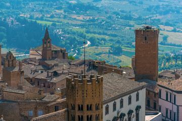 Medieval towers rise above the roof tops in Orvieto, Italy in summer