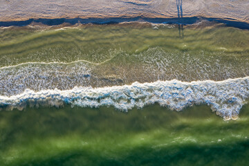 surf, waves on the seashore, top view
