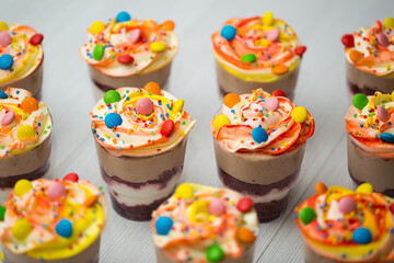 Trifles in plastic glasses.