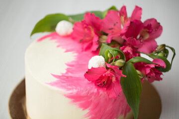 Cake with pink decor and flowers