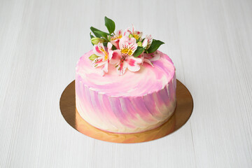 Cake with pink decor and flowers