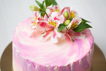 Cake with pink decor and flowers