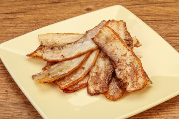 Roasted juicy bacon in the plate