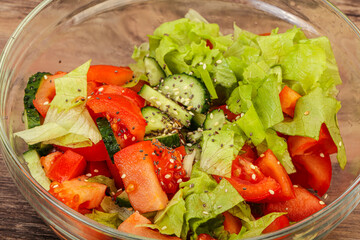 Vegan salad with tomato, cucumber and chia
