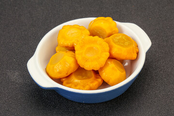 Marinated yellow patisson in the bowl