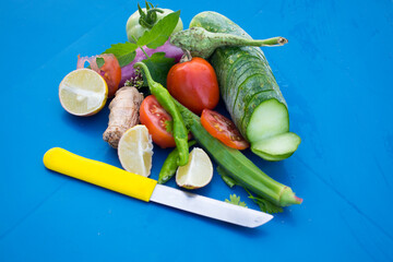 fresh vegetables on a wooden blue board. Vegetables isolated with space for text. Food chart concept for dieting