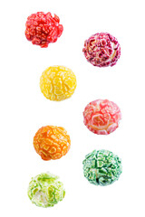 Sweet multicolor popcorn on a white isolated background