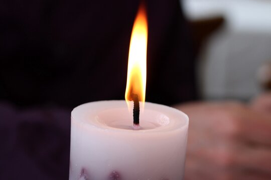 A close-up of a burning candle.
